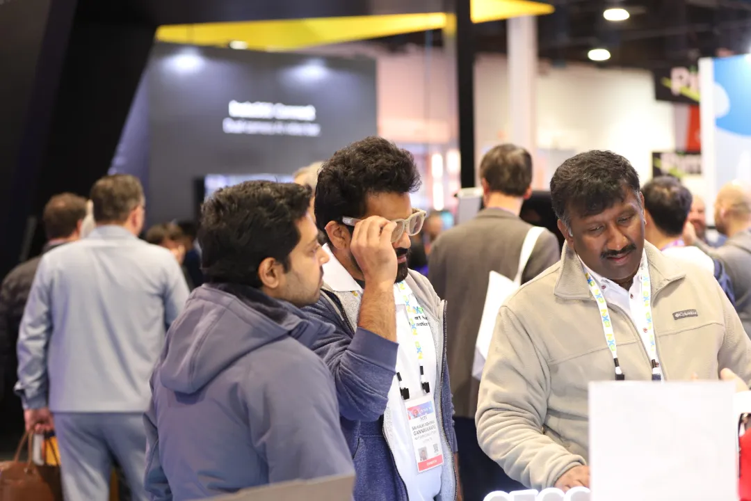 Visitors trying Emdoor AI glasses at CES 2025 booth Visitors trying Emdoor AI glasses at CES 2025 booth