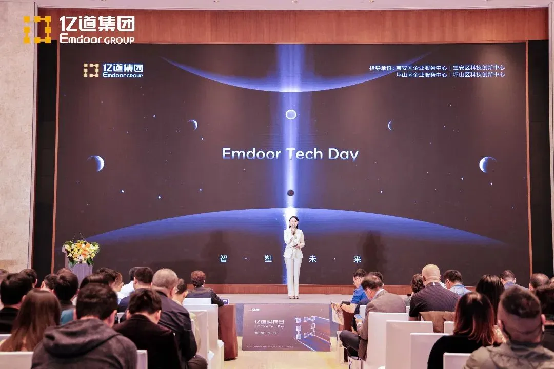 Host presenting on stage at Emdoor event Host presenting on stage at Emdoor event